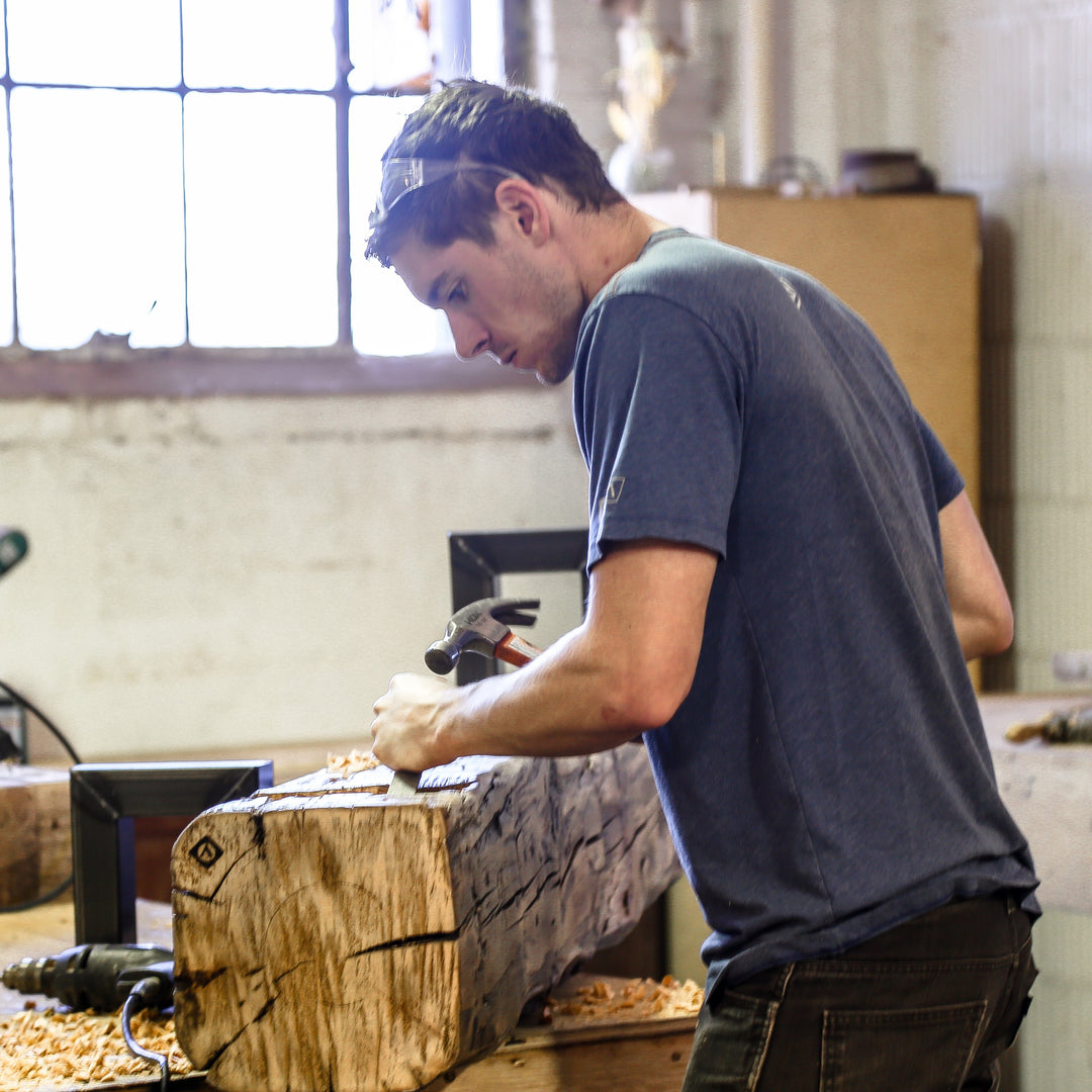 quality craftsmanship handmade reclaimed wood beam bench chiseled by Andrew. in Chicago workshop. Owner of Vault FUrniture