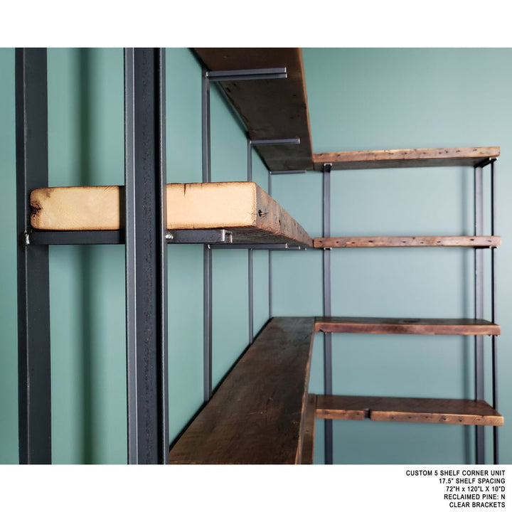 wall mounted corner bookshelf handmade in USA with heavy duty solid steel shelf brackets and 1.5" reclaimed pine wood shelves. Floating bookcase on green wall with solid metal shelf brackets. 5 tier shelving unit by Vault Furniture