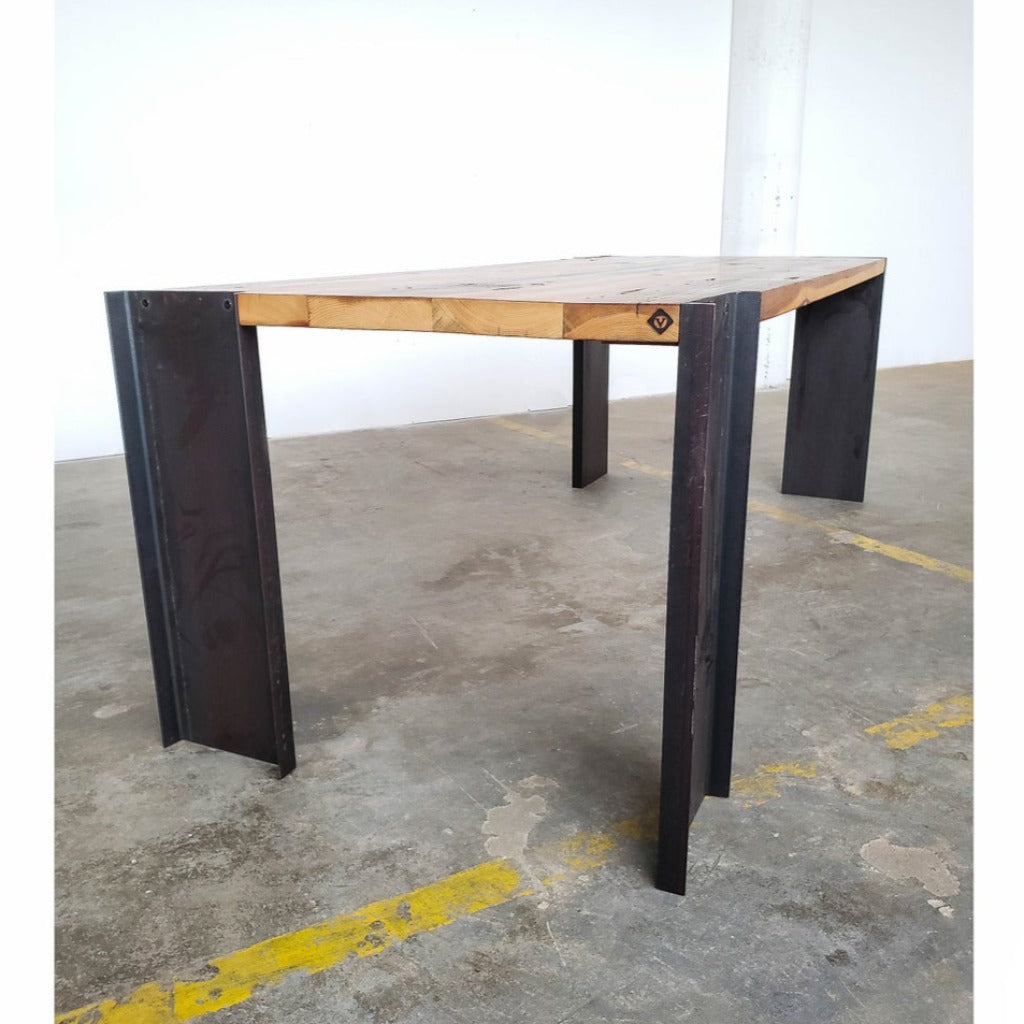 Modern industrial reclaimed pine dining table with steel legs.
