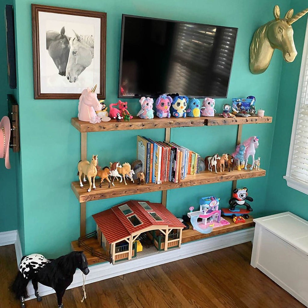 Kids room shelf for toy storage. 3 shelf unit 48" long reclaimed pine and brass shelf brackets by Vault Furniture