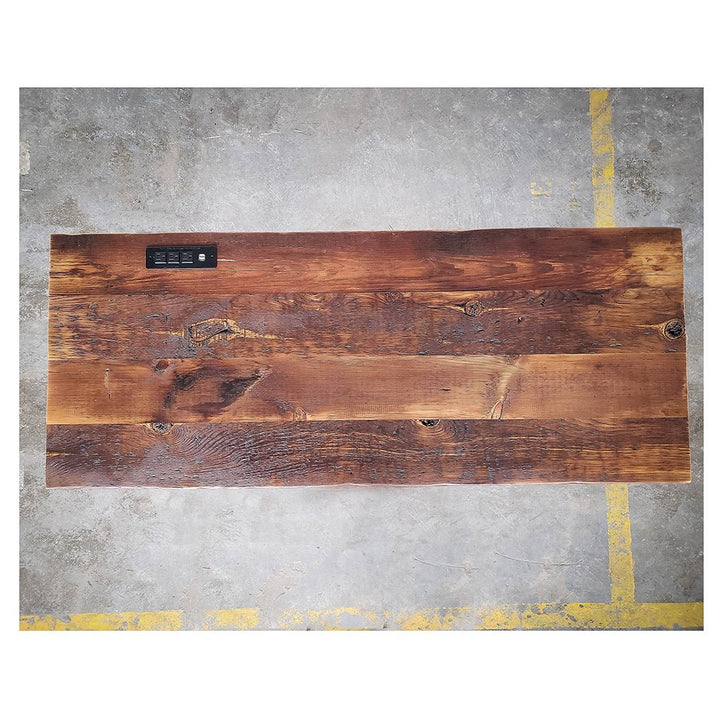Reclaimed wood table top with power strip by Vault Furniture