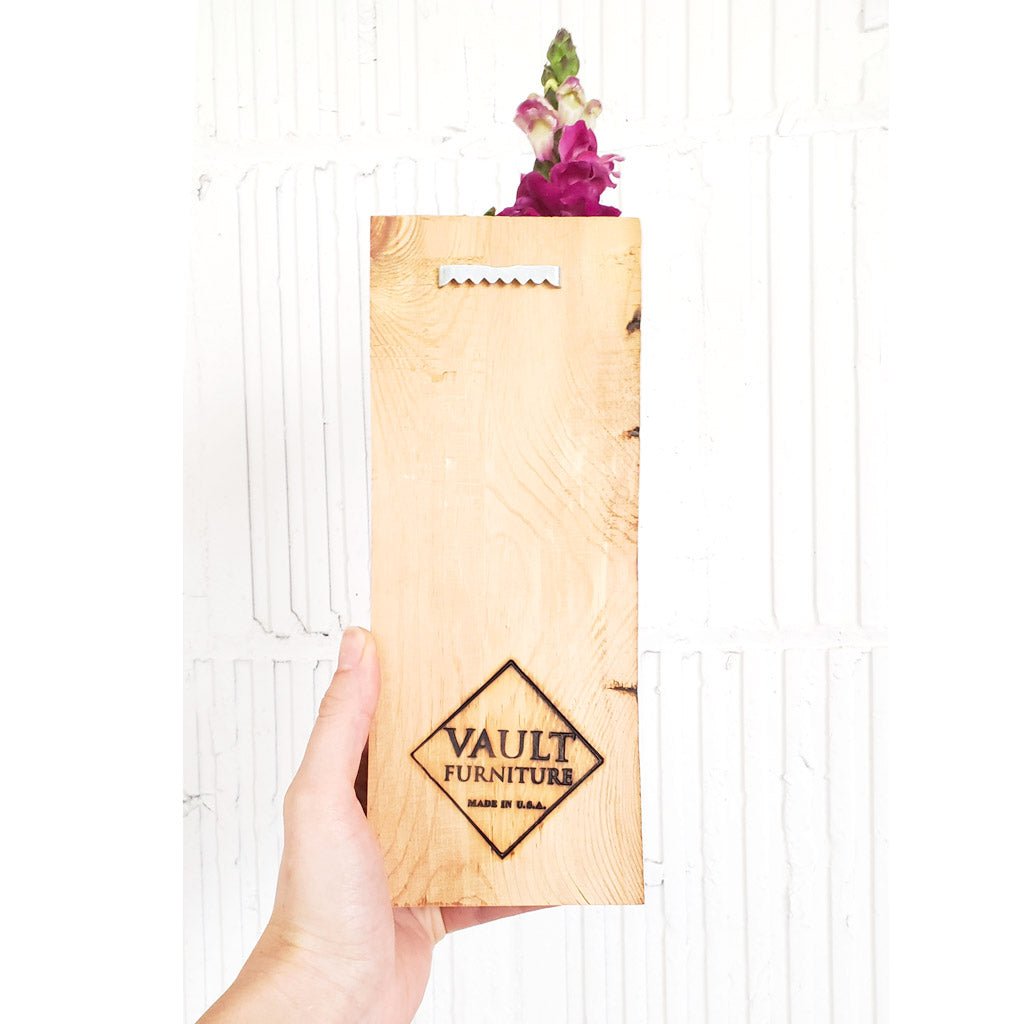 wood wall sconce with hanging teeth by Vault Furniture