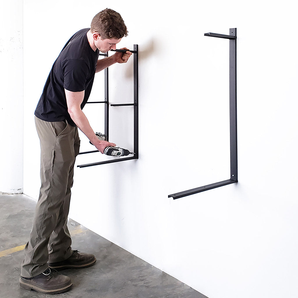 Anchoring heavy duty shelf brackets to wall. vault furniture