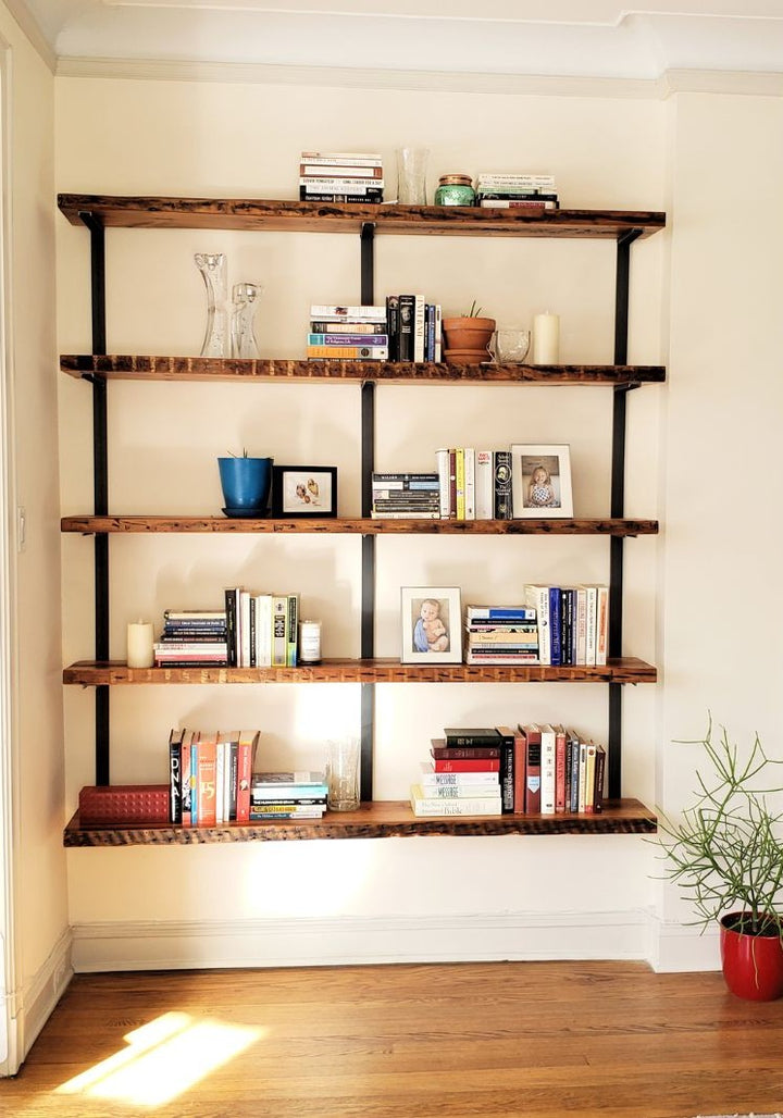 Large minimal heavy-duty reclaimed pine floating wall-mounted shelving unit with steel brackets. 