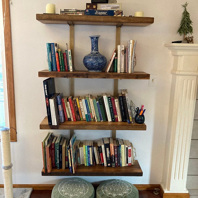 reclaimed pine shelves in surface plane finish with brass brackets