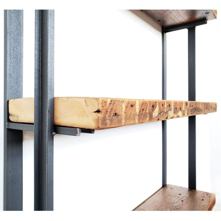 close shot of heavy duty reclaimed pine wood floating shelves and wall mounted bookshelves with steel bookend brackets.