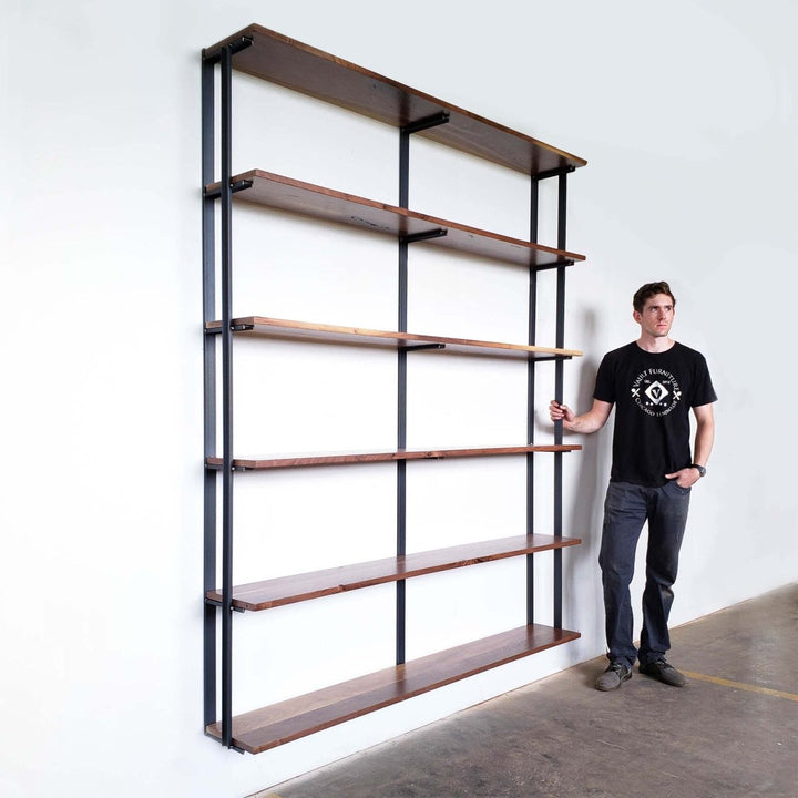Tall wall mount floating bookshelves. Heavy duty steel bookcase brackets on white wall. 