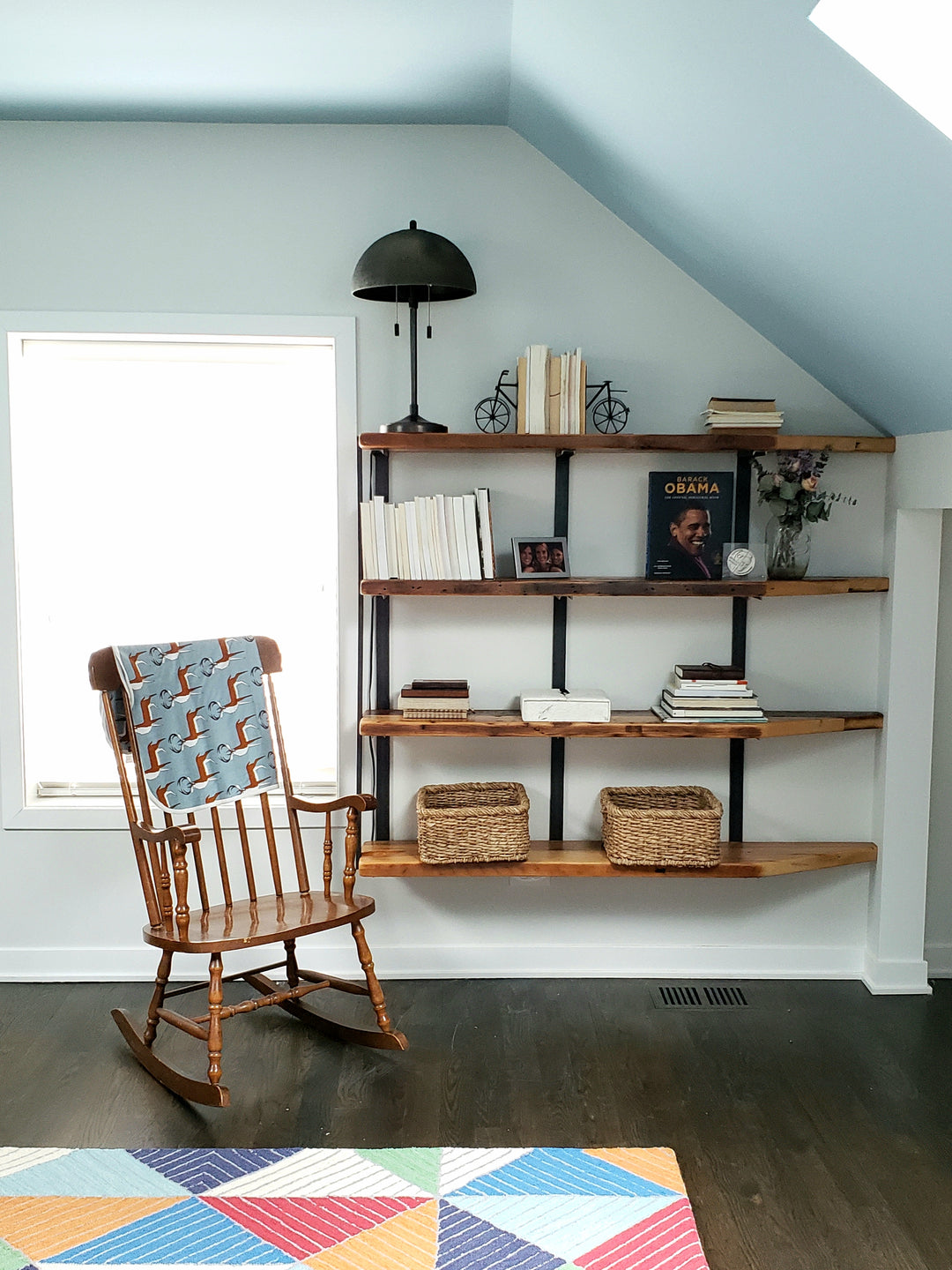 solid hardwood floating bookshelves with steel brackets and reclaimed wood. 4 wall mounted shelves.