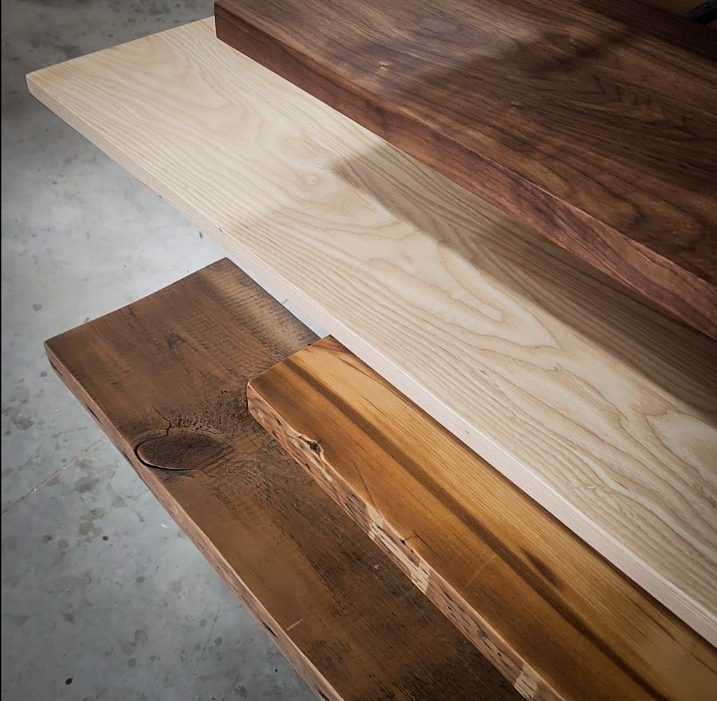 Wood shelves with differet finishes for Vault Furniture floating shelving units. Ash, knotty alder, black walnut and relcaimed pine.