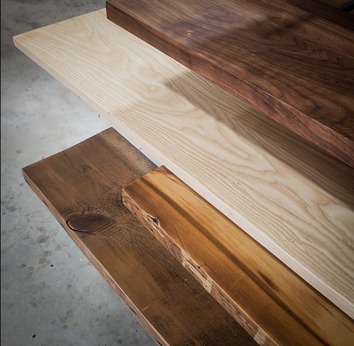 Wood shelves with differet finishes for Vault Furniture floating shelving units. Ash, knotty alder, black walnut and relcaimed pine.