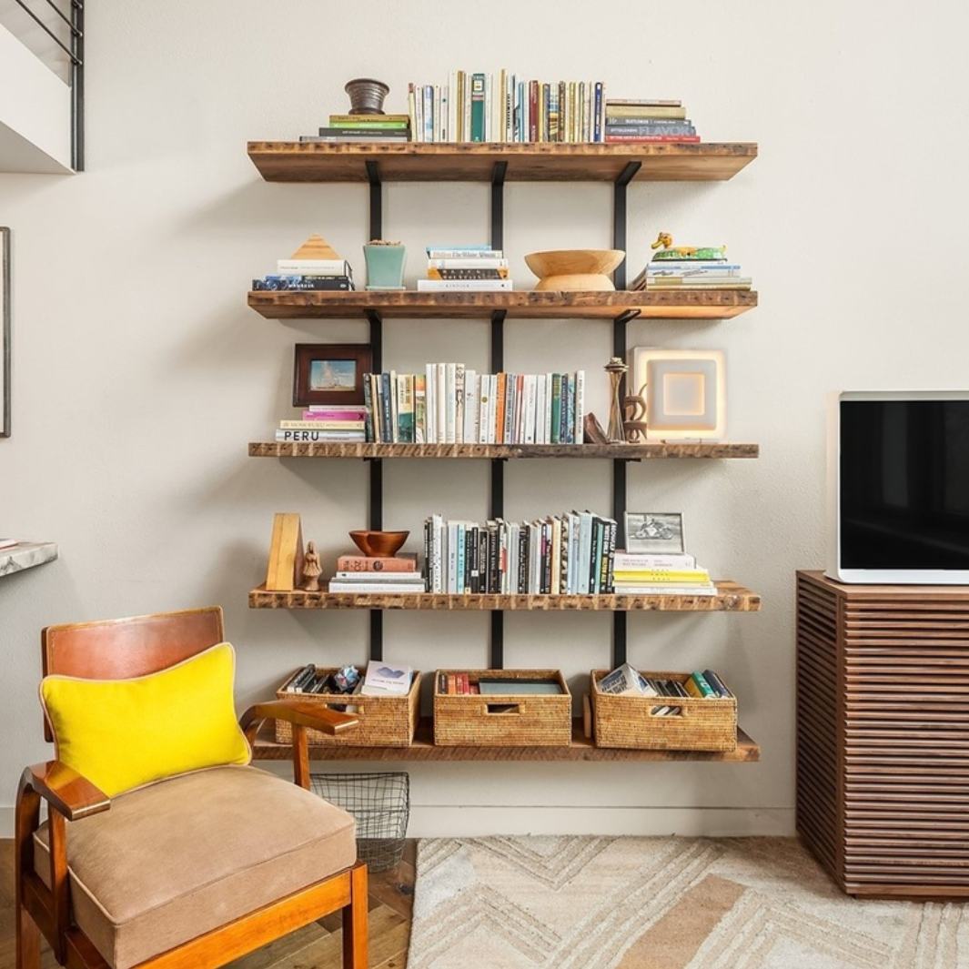 5 wall mounted shelves for books and decor storage and display featuring floating reclaime pine shelves and steel brackets. 