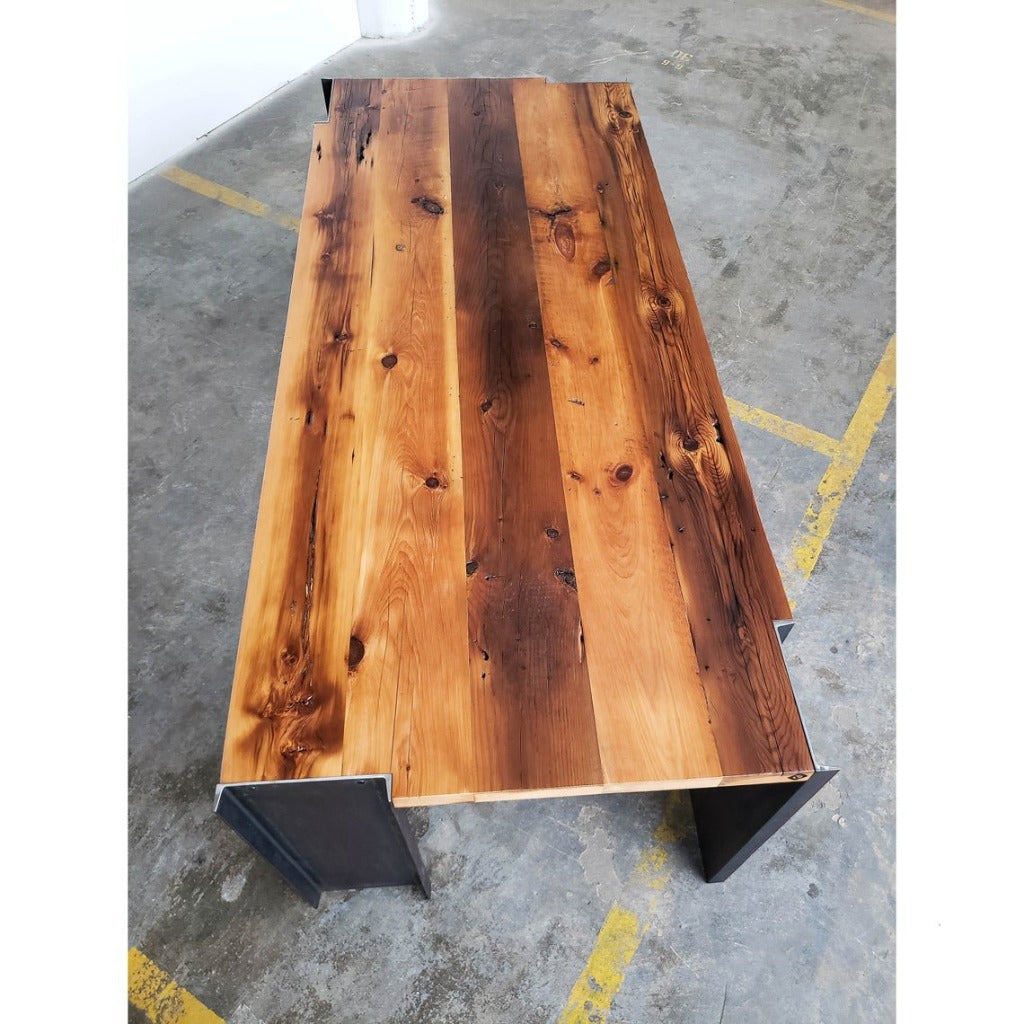 Handmade American reclaimed pine dining table with steel legs. Modern, industrial, sleek, minimalist design. Wood and metal dining room table.